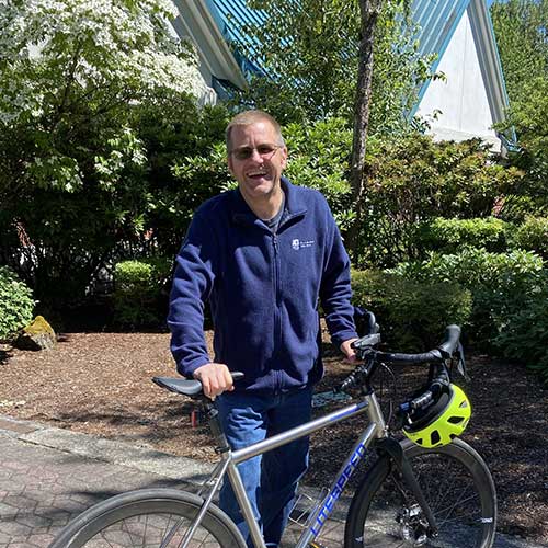 Man standing with his bicycle