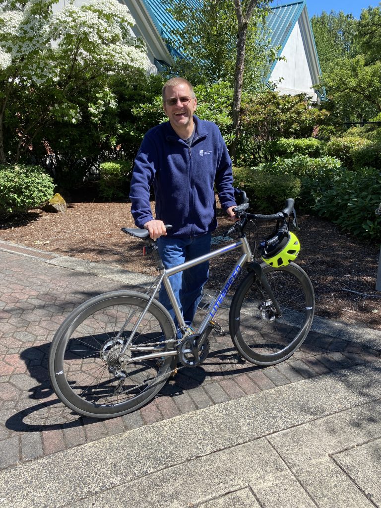 Man standing with his bicycle