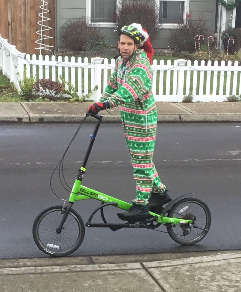 Made riding an elliptical bicycle dressed in a holiday onsie.
